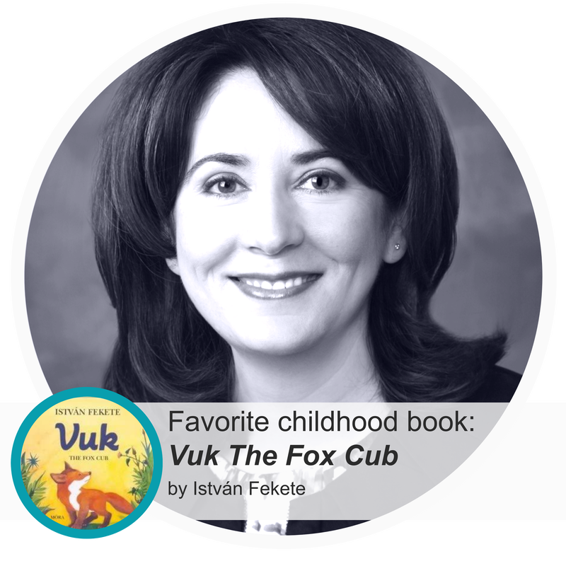 An image of Judit Slezak, board member at Cultured Kids and Marketing and Business Development professional at A Source For Learning with her favorite childhood book, Vuk The Fox Cub by István Fekete